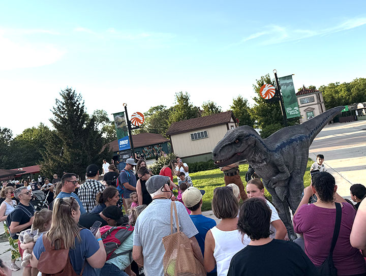 Fairytale Entertainments 14 foot Walking Velociraptor entertaining families at Brookfield Zoo Chicago during the Summer of Dinosaurs event.